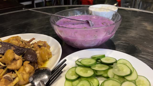 Vietnamese purple cream vegetable soup Red cabbage cream decorated with liquid cream