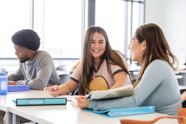 istock Two female university students smile and enjoy conversation 2138937842