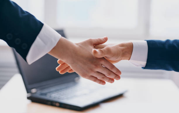 istock Business people shake hands at work In the office employees are mutual understanding 2138942190