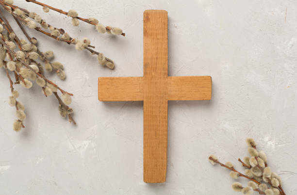 istock Cross with willow branches on concrete background, top, view. Palm Sunday concept 2138942306