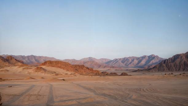 istock Mountains in the desert at dawn. 2138974069