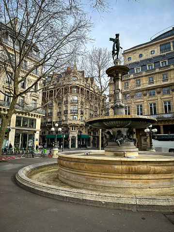 Paris, France - 20.02.2024. Fountain of Theatre Francais located at Rue de Richelieu in Paris, France. Salle Richelieu French comedy performing arts theatre