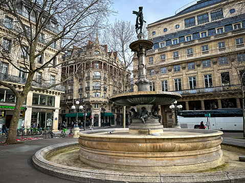 Paris, France - 20.02.2024. Fountain of Theatre Francais located at Rue de Richelieu in Paris, France. Salle Richelieu French comedy performing arts theatre