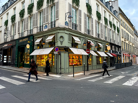 Paris, France - 20.02.2024. Rue Bonaparte and Rue Jacob cross and famous Laduree Patisserie, Upscale bakery with Parisian origins, specializing in French macarons in a number of flavors.