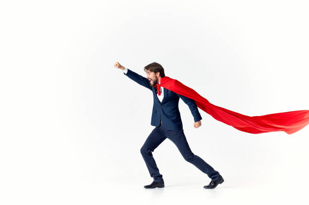 istock businessman superhero suit victory light background success advertising 2139074375