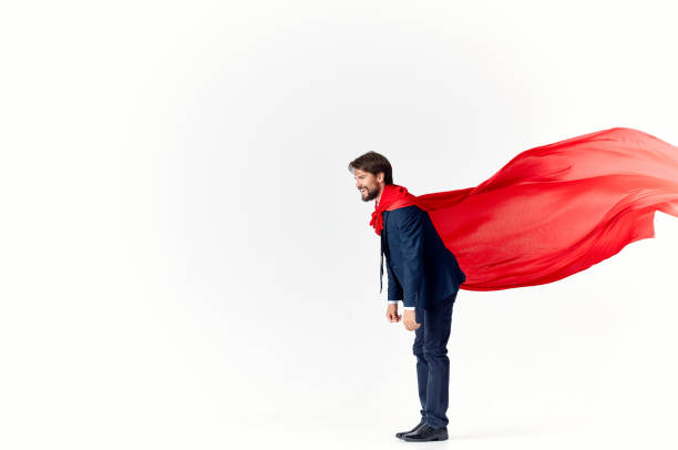 business man in a red cloak on a light background gesturing with his hands flying success advertising. High quality photo