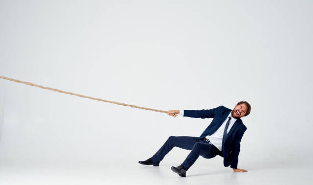 istock man with rope in hand on light background business finance 2139083837