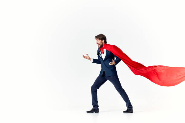 istock businessman superhero suit victory light background success advertising 2139086493