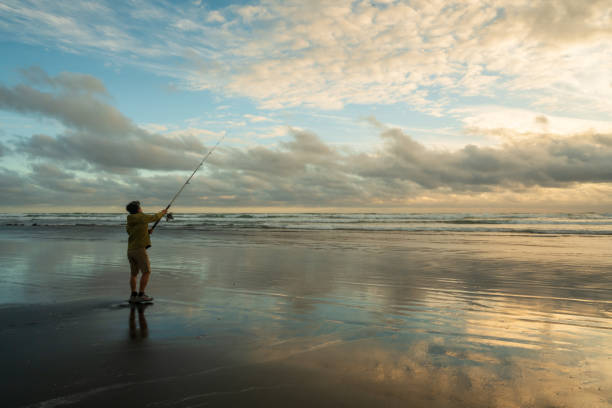 istock Man fishing by the sea. 2139090147