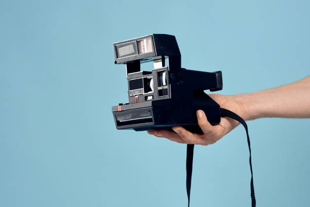 istock camera in hand art creativity professional phone 2139114558
