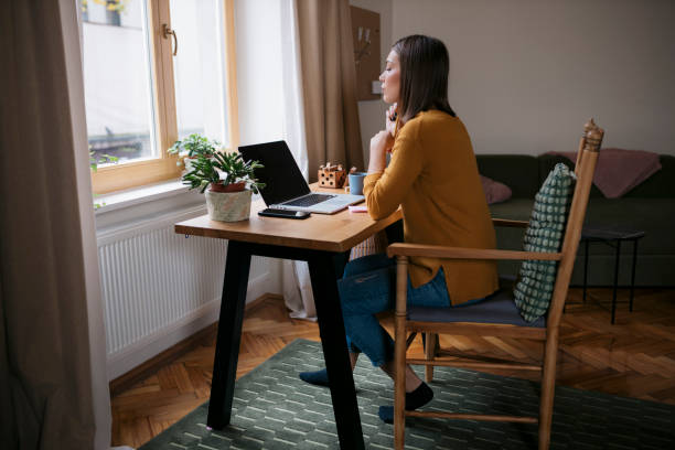 istock Beautiful caucasian woman working from home 2139115619