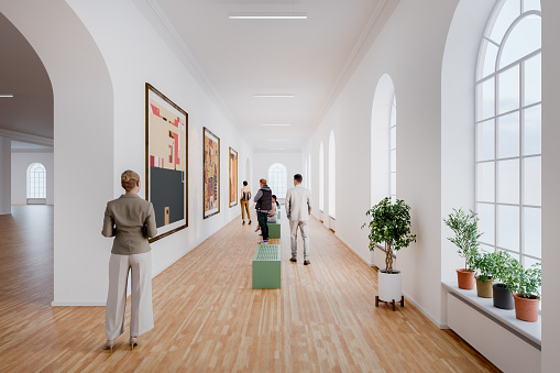 People in art gallery. 3D generated image. Generic location. Images on the wall are my own and are CGI as well.