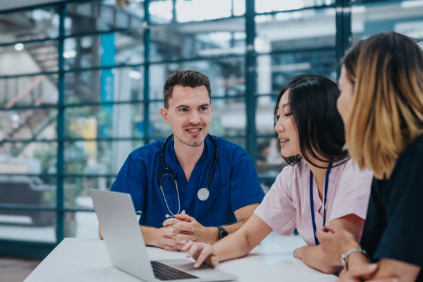 istock Female nurse leading team meeting 2139198980