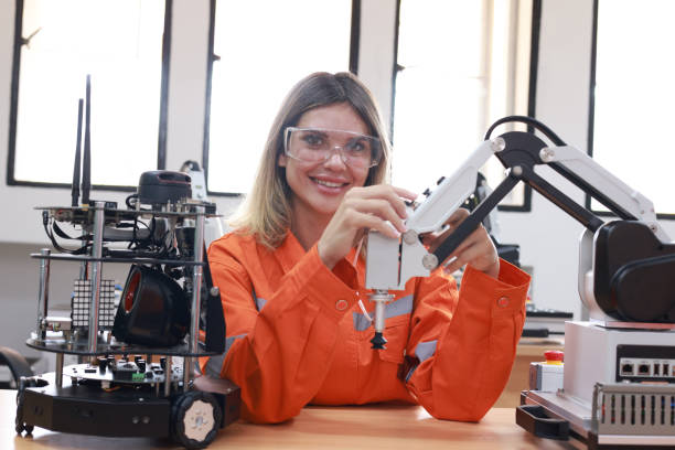 istock A captivating portrait showcasing a young female engineer confidently interacting with a state-of-the-art robotic arm in a cutting-edge industrial laboratory facility. 2139209414