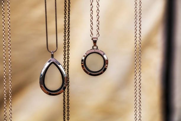 Necklaces and Chains Suspended Against a Light Background
