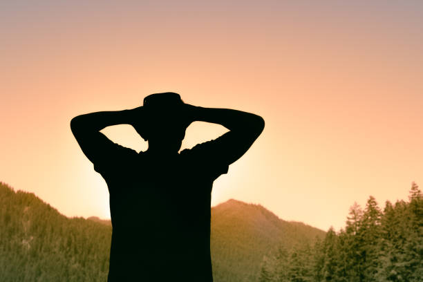 Men enjoying beautiful sunset in the mountain area in Washington state.