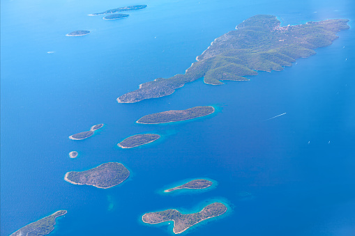 Aerial view of islands in Adriatic Sea of Croatia. Archipelago in blue tropical water