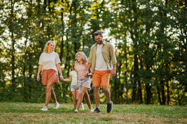 istock A young family is spending day in nature and walking. 2139294826