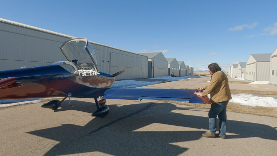 Pilot prepares to fly light airplane made from a kit, Vans RV-9A Airplane