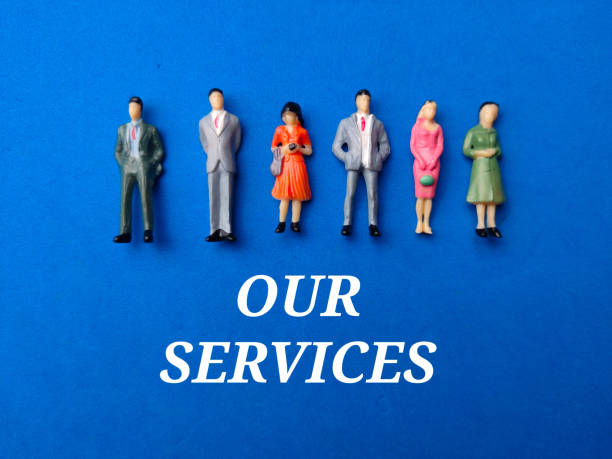 istock Miniature people with the word OUR SERVICES on a blue background 2139420174