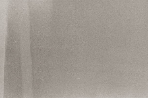 istock A real, black and white 35mm format spoiled photo with dust and scratches. Camera roll with scratches, dust, dirt, out of focus image. 2139428918