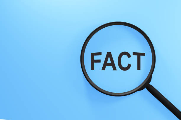 istock The inscription Fact through magnifying glass on blue background. 2139431105