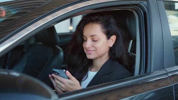 istock Pretty driver in automobile ready to drive 2139440851