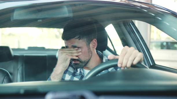 istock Guy sitting in his car and feeling stressed and upset on the road. Slow motion 2139441400
