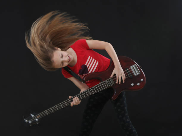 Attractive man playing electric guitar
