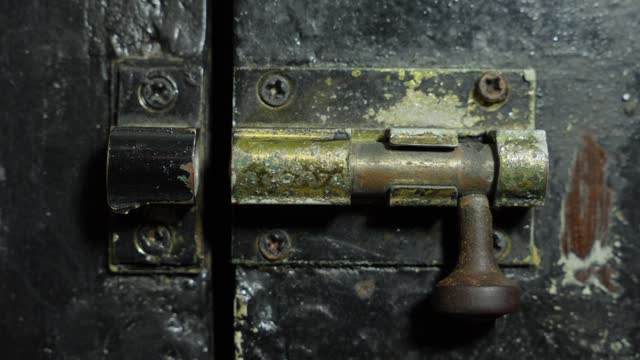 Old Bolt Lock On A Vintage Wooden Door. Close-up Shot