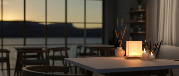 istock A table with a dim light from a table lamp in a contemporary romantic restaurant at night. 2139584086