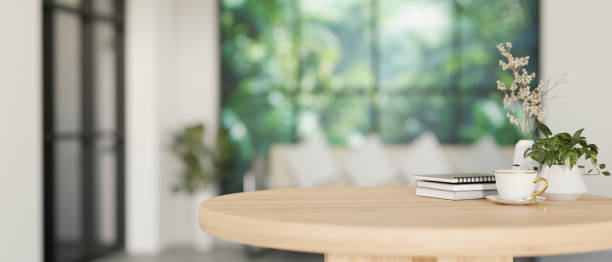 istock A space for display products on a minimalist round wooden table in a contemporary white living room. 2139584588