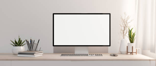 istock A minimalist white home office with a PC computer mockup on a wood table against the white wall. 2139584606
