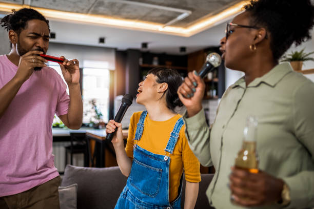 istock Multiracial group of friends having karaoke night. 2139793226
