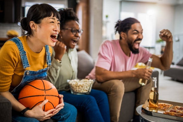 istock Multiracial group of friends watching basketball game 2139793230