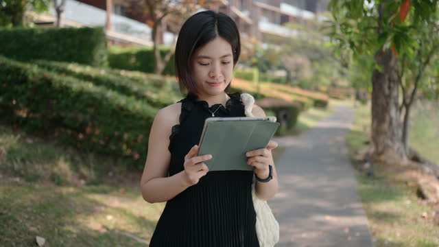 Asian people using digital tablet Forecasting real estate and retirement fund for calculating tax with data