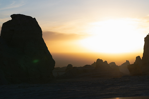 The wind-eroded landforms in the desert look like Martian landforms under the sunlight