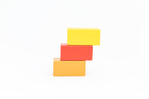 istock Colored wooden rectangular blocks on a white background. Blank yellow, red and brown colors blocks with space for text.. 2139843397