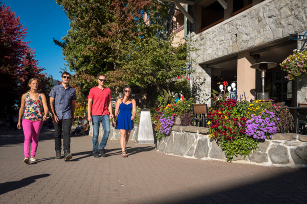 istock Friends walk down pedestrian walkway together 2139847141