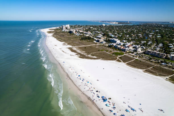 Aerial view of calm bay, beach and community Aerial view of calm bay, beach and community, Siesta Key Beach florida beach above stock pictures, royalty-free photos & images