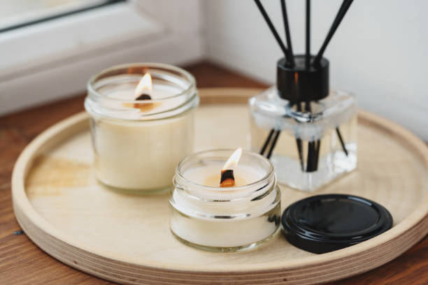 istock Scented Candles and Diffuser on a Wooden Tray by the Window 2139898080