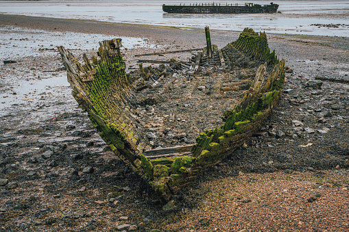 Two shipwrecks on the banks of The Swale near St Giles, Kent, England, UK