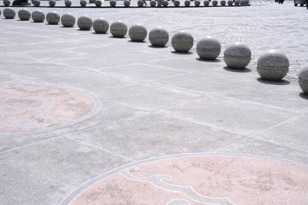 Pedestrian boundary stone ball with road