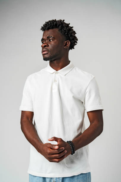 istock African Man in White Shirt Looking Sideways 2139910246