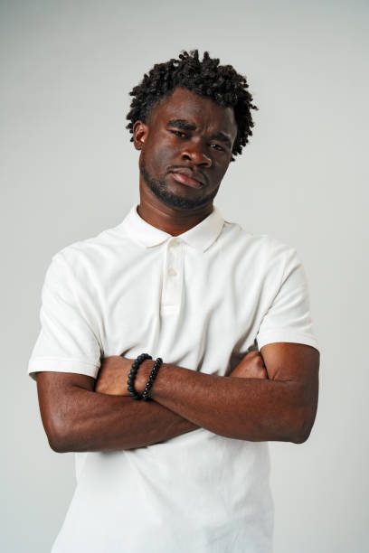 istock Man in White Shirt With Arms Crossed 2139923076