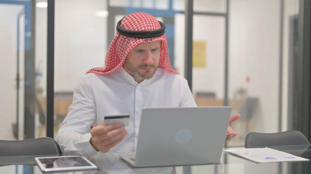 istock Arab Man Upset with Online Shopping Failure on Laptop 2139941132