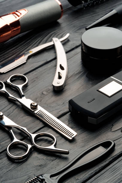 istock Professional Barber Tools Laid Out on Dark Wooden Surface 2139942697