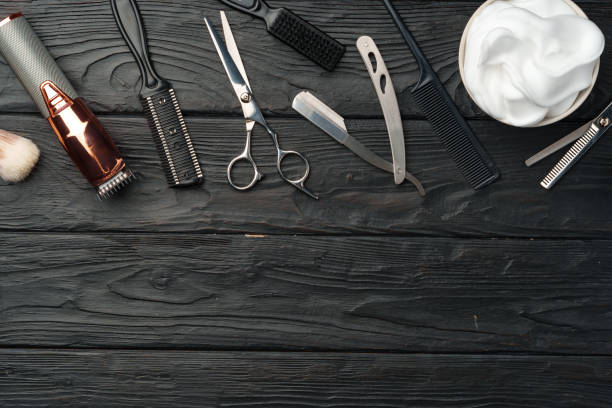 istock Professional Barber Tools Laid Out on Dark Wooden Surface 2139981413