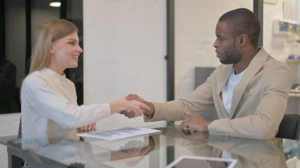 istock Multi Ethnic People Shaking Hand after Meeting 2139990639