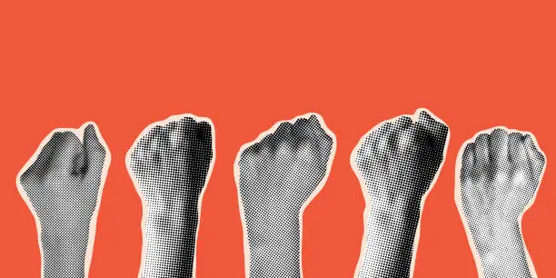 Vector illustration of Halftone hands raised up with closed fist.